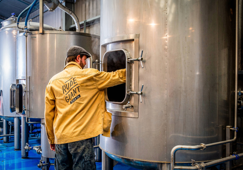 Lyall checks the fermentation tanks at Rude Giant's brewery